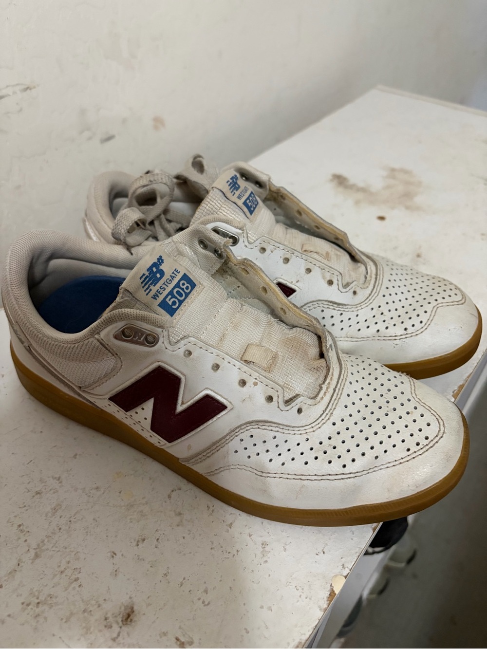 New Balance Men’s White Sneakers with Maroon Logo and Gum Sole